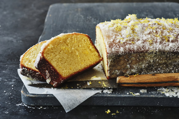 This lemon cake is briefly soaked in syrup and rolled in vanilla-lemon sugar to create a crust.