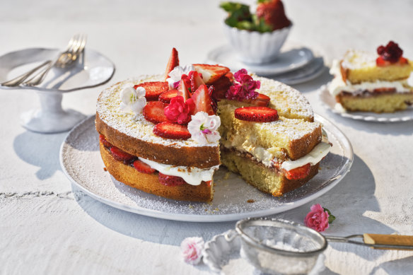 Decorate the cake with strawberries and/or edible flowers.