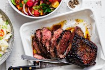 Barbecued lamb leg with tomato and mint.