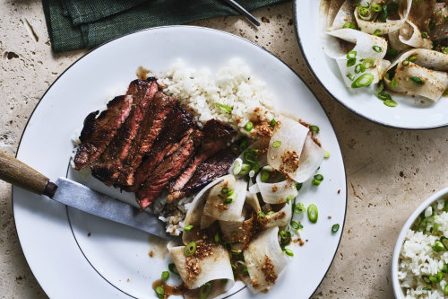 Marinated minute steaks with sesame daikon salad and steamed rice.
