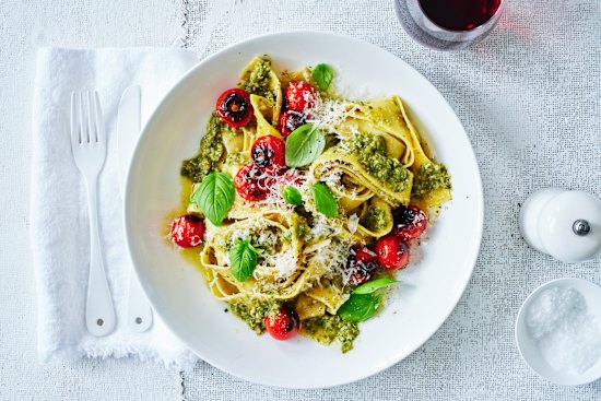 Pesto pappardelle with blistered cherry tomatoes. Styling by Hannah Meppem.