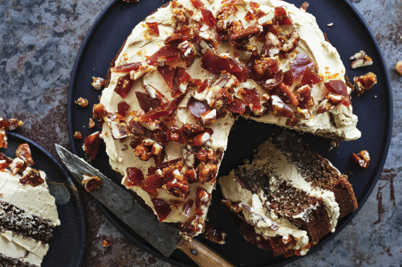 Decorate the cake with brittle (pictured) or a ring of roasted pecans.