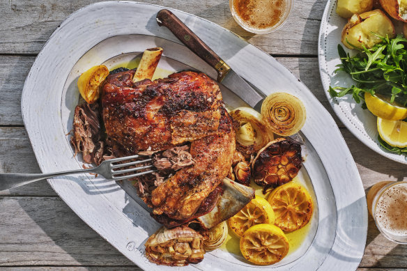 Roasted garlic, onion and lemon become the dressing for this simple lamb roast.