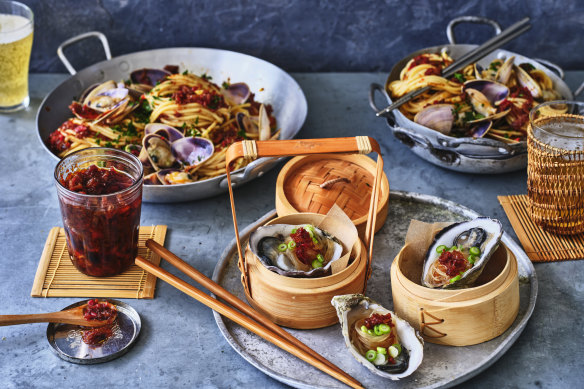 Adam Liaw’s homemade XO sauce (front left), spaghetti vongole (rear) and steamed oysters (front).