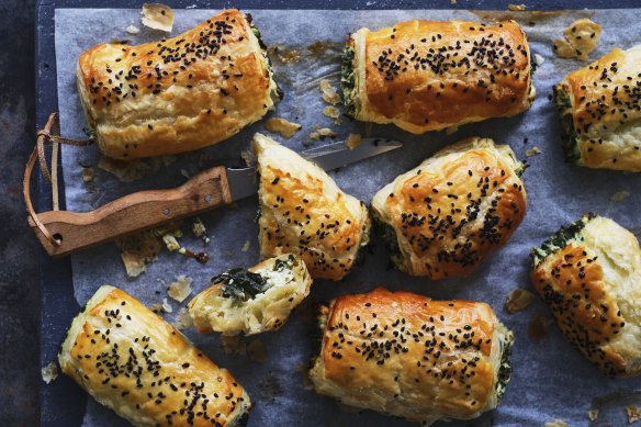 Kale and three-cheese pastries sprinkled with nigella seeds.