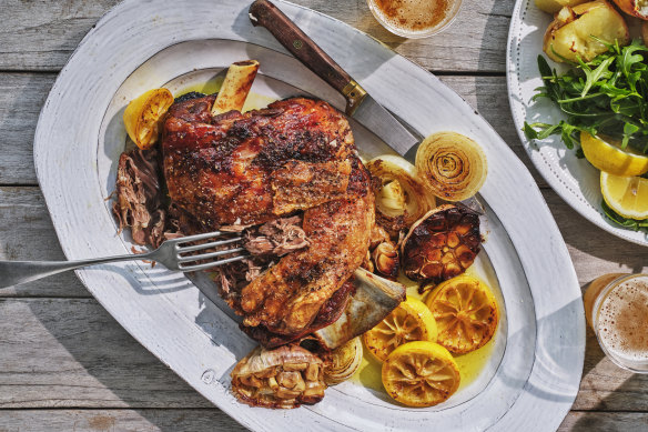 Roasted garlic, onion and lemon become the dressing for this simple lamb roast.