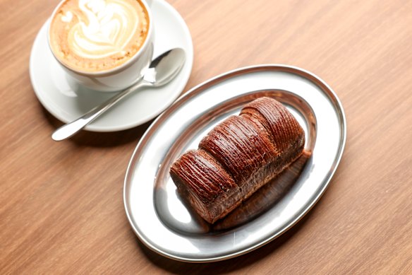Pastries, such as this chocolate-raspberry roll, come from Via Porta's Hawthorn bakery.