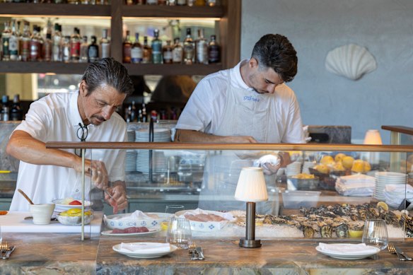 Chef Giovanni Pilu (left) behind the crudo counter at Flaminia.