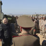 In this undated photo provided by the North Korean government, North Korean leader Kim Jong Un watches an artillery exercise at an undisclosed place in North Korea. 