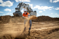 Adani Mining Australia chief executive David Boshoff ceremonially begins the removal of rock overburden at the Carmichael thermal coal mine in Queensland's Galilee Basin.