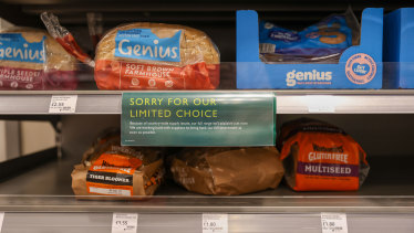 A ‘short supply’ sign on a bread shelf at a Waitrose supermarket in London.