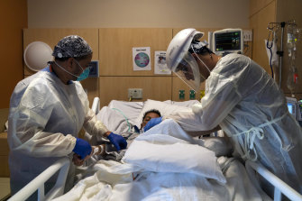 Medical staff check on a coronavirus patient at a hospital in Los Angeles last month.