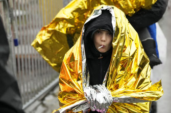 A child wrapped in a rescue emergency blanket waits with others in Medyka, south-eastern Poland, on Friday after crossing the border from Ukraine.