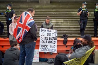 People protest against the pandemic bill outside the Victorian Parliament on Thursday.