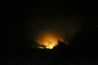 Flames are seen at the site of a plane crash, a few miles away from the city of Kavala, in northern Greece, 