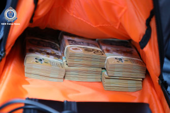 Bundles of $50 notes were seized during the investigation.