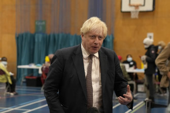British Prime Minister Boris Johnson speaks to the media as he visits a COVID-19 vaccination centre at Little Venice Sports Centre, in London on Friday.