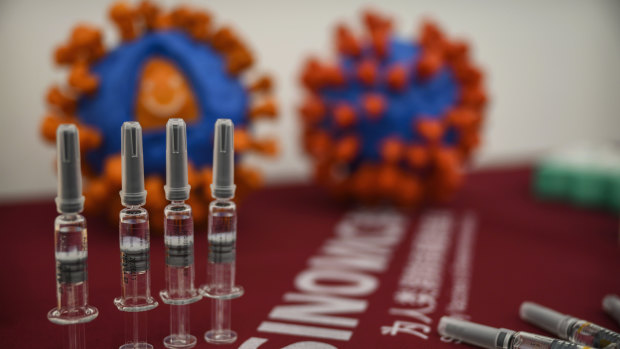 Syringes of the potential COVID-19 vaccine CoronaVac are seen on a table at Sinovac Biotech in Beijing.