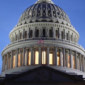 The US Capitol stands at sunset in Washington, DC.