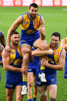 West Coast’s Josh Kennedy is chaired off after his 250th game.