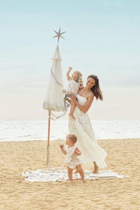 Sarah wears Country Road dress, Scanlan & Theodore chain choker necklace, and Baby Anything earrings and fine necklaces. 
Mila and Frankie wear Country Road. 
Basil Bangs “Salt” umbrella from Top3 By Design. Christmas decorations from Myer.