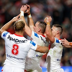 The Dragons celebrate Clint Gutherson’s try.
