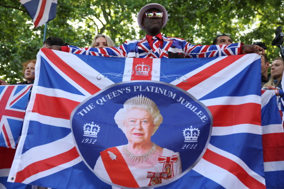 A royal well-wisher on The Mall near Buckingham Palace before Platinum Jubilee celebrations.