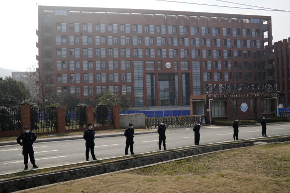 Security personnel guard the entrance to the Wuhan Institute of Virology.