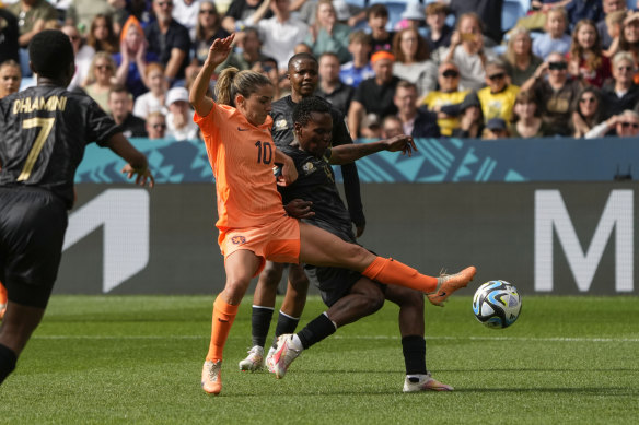 Netherlands’ Danielle van de Donk, left, and South Africa’s Noko Matlou vie for the ball.