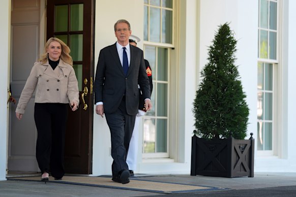 Treasury Secretary Scott Bessent and White House press secretary Karoline Leavitt walk to speak with reporters outside the West Wing on Wednesday,