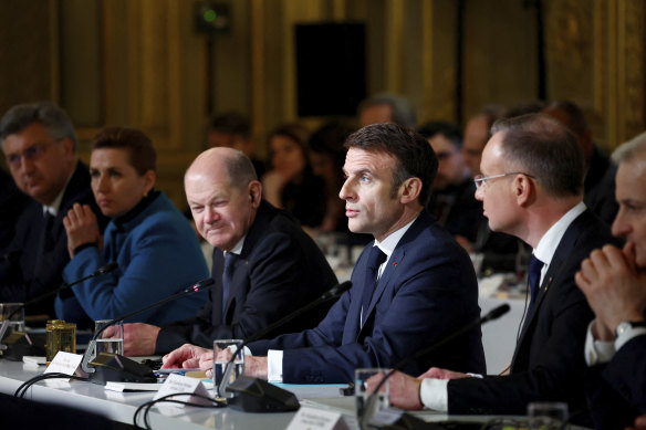 German chancellor Olaf Sholtz, pictured sitting on Emmanuel Macron’s right at the Elysee Palace in Paris.