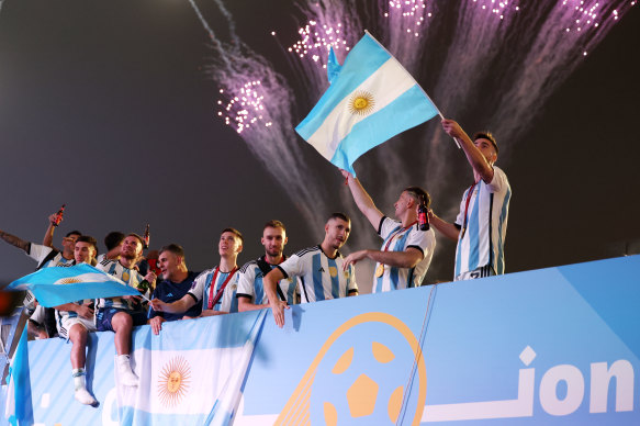 Argentina’s players celebrate their World Cup win on an open-top bus outside Doha.