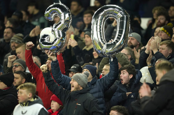 Liverpool fans mock Everton with balloons signifying 30 years since Everton’s last trophy.