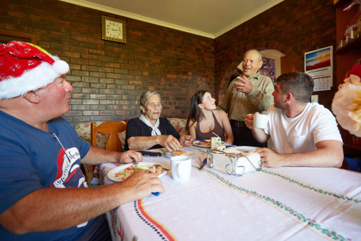 Good to see you: Giuseppe Callipari (standing) with (left to right) at breakfast with son-in-law Frank Zappia, wife Giuseppa, granddaughter Esta and grandson Joseph.