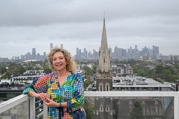 Melissa Lowe on the communal balcony of her Hawthorn apartment block.