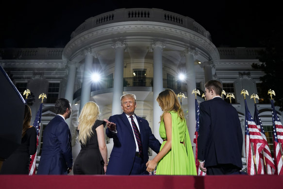 From left, Donald Trump jnr, Tiffany Trump, President Donald Trump, first lady Melania Trump and Barron Trump stand on stage on the South Lawn of the White House after watching opera singer Christopher Macchio at the closing of the Republican National Convention.