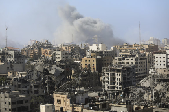 Smoke rises following Israeli airstrikes on Gaza City, Thursday.