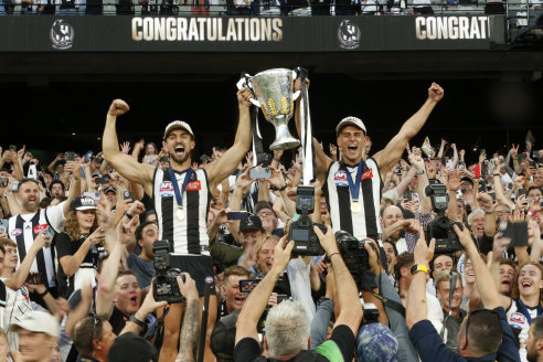 Brothers and Collingwood stars Josh and Nick Daicos celebrate the 2023 premiership.