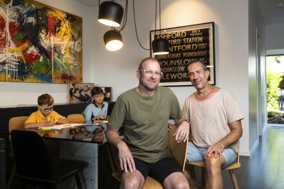 Paul Wood (left) and Trent Schatzmann with two of their three children. They want same-sex couples to have the same opportunity to adopt as other couples.