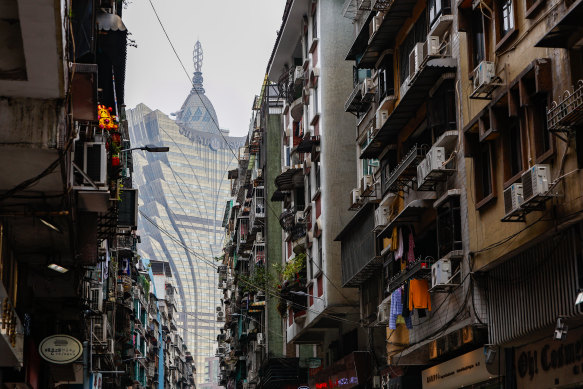 The Grand Lisboa casino towers over apartment blocks in downtown Macau. 