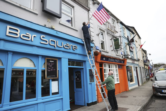 Publicans put up US flags outside the Blue Square bar in Ballina, Ireland.