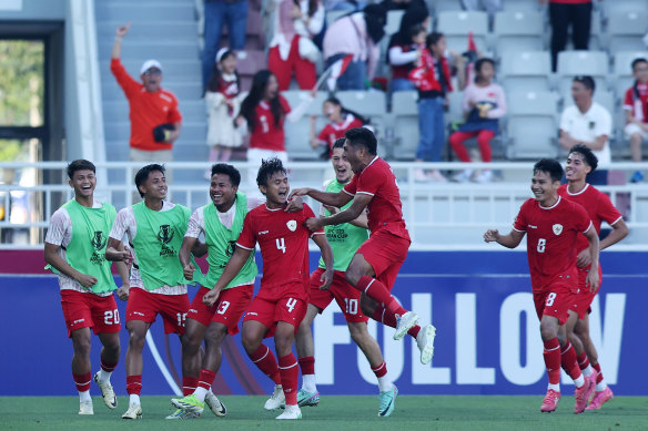 Indonesian players celebrate their goal just before half-time.