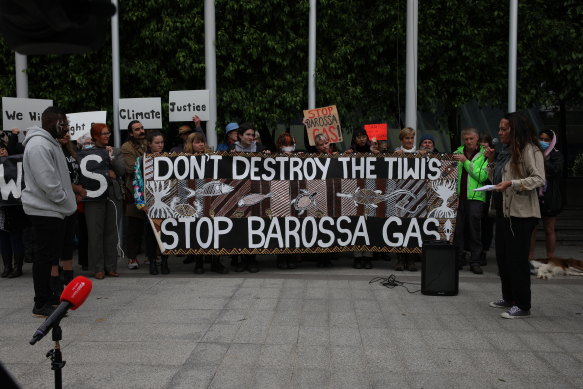Protesters hold a banner at the front of the Federal Court, where Santos’ appeal hearing is taking place.