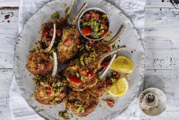Parmesan-crumbed lamb cutlets with tomato, caper and green olive salsa.