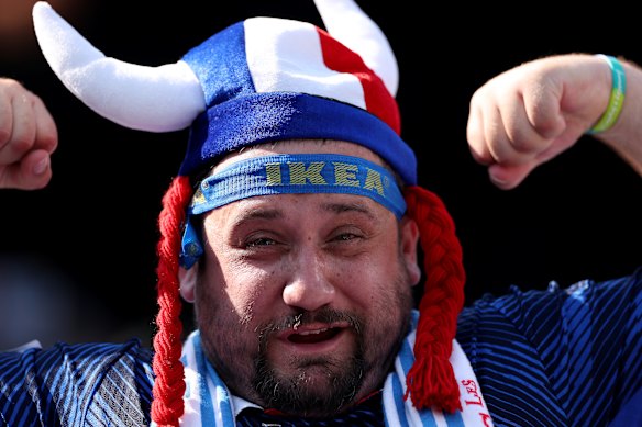 France fans pose for photos before the clash with Sweden.