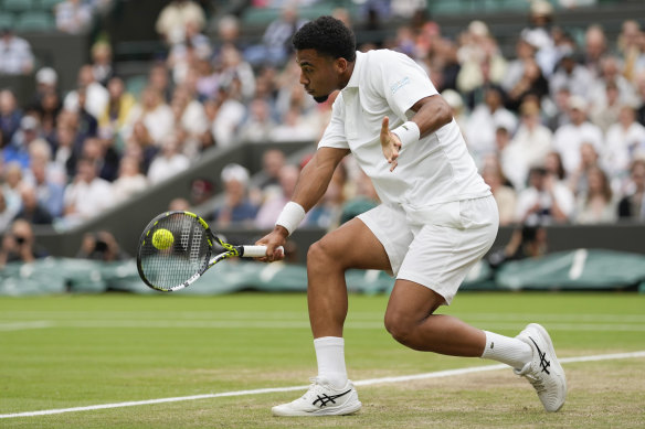 Arthur Fils plays a backhand return.