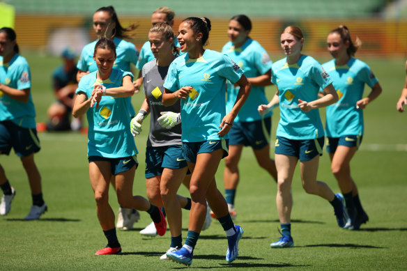 Mary Fowlers shares a laugh with teammates during training in Perth.