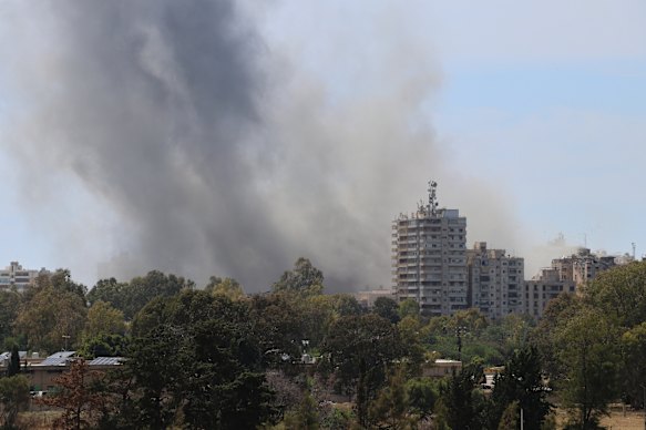 Smoke rises after Israel's air strike on the southern Lebanon port city of Tire on Sunday.