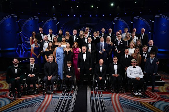 John Newcombe (centre) surrounded by some of the tennis luminaries at the awards night.