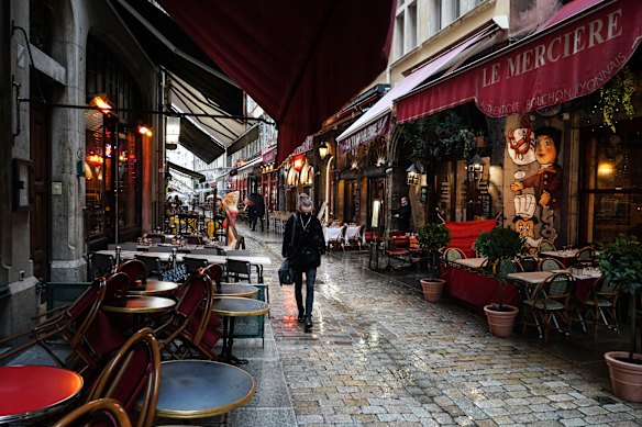 Empty restaurants in the centre of Lyon. All of France is subject to a nightly curfew; restaurants and bars have been closed for months on end.